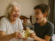 a boy and woman holding money